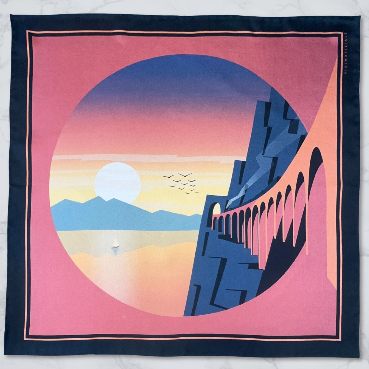 L'Odysee luxury silk Pocket Square  with Amalfi inspired landscape design on a marble surface