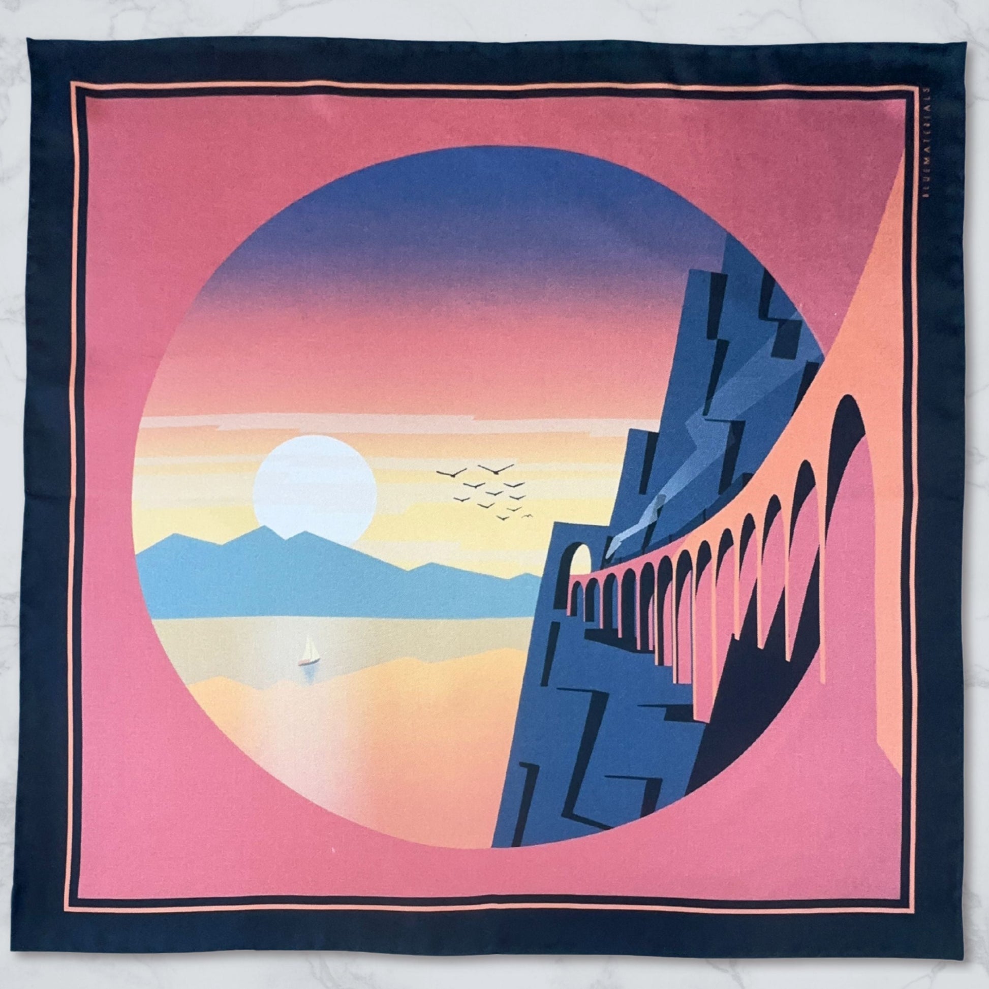 L'Odysee luxury silk Pocket Square  with Amalfi inspired landscape design on a marble surface